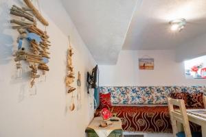 a living room with a couch and a table at Ilio Socrates in Skala Marion