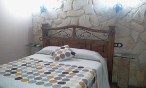 A bed or beds in a room at El Rincon Del Villar
