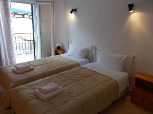 Postel nebo postele na pokoji v ubytování Eva Apartments