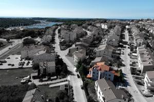 an aerial view of a city with houses and a street at Vratovic Apartments in Pula