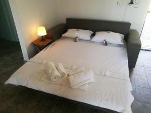 Кровать или кровати в номере Alekos Beach Houses-Caretta