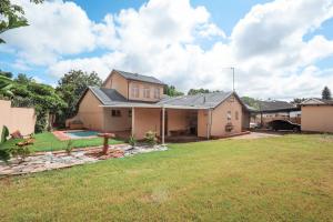 an image of a house with a yard at Menlyn Maine: The Exquisite Lunette in Pretoria