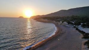 an aerial view of a beach at sunset at Limeri Traditional Guest House in Monólithos