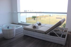a living room with a tub and a couch and a tub at Royal Thalassa Monastir in Monastir