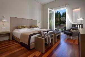 a bedroom with a large bed and a large window at M'AR De AR Aqueduto in Évora +40 photos