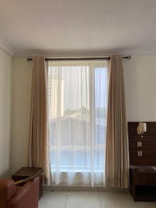 Area soggiorno di Posh Hotel and Suites Victoria Island