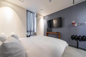 Posteľ alebo postele v izbe v ubytovaní Hotel DDK