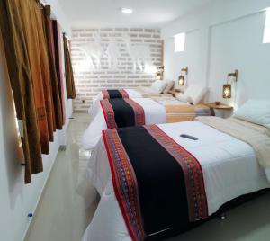 Postel nebo postele na pokoji v ubytování Hotel Sal Andina