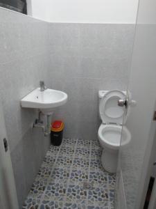 a bathroom with a sink and a toilet at Lapyahan Guest House in Siquijor +13 photos
