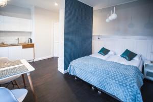 Posteľ alebo postele v izbe v ubytovaní Good Time Aparthotel