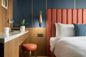 Voodi või voodid majutusasutuse Kindness Day Hotel toas