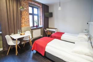 Posteľ alebo postele v izbe v ubytovaní Good Time Aparthotel