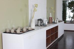 a white counter with a bunch of candles on it at Royal Thalassa Monastir in Monastir