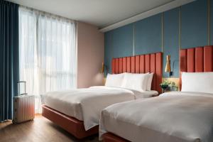 Voodi või voodid majutusasutuse Kindness Day Hotel toas