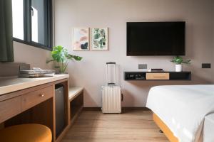 Voodi või voodid majutusasutuse Kindness Day Hotel toas