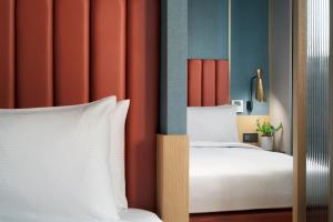 Voodi või voodid majutusasutuse Kindness Day Hotel toas