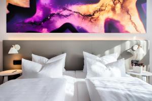 Postel nebo postele na pokoji v ubytování Offenbach Plaza Hotel