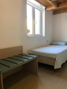 A bed or beds in a room at Villanova Rhodes Comfy Apartment