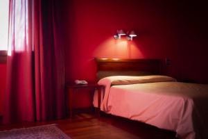 Postel nebo postele na pokoji v ubytování Hotel Due Platani