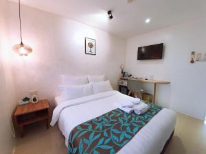Voodi või voodid majutusasutuse BLUE OCEAN BOUTIQUE HOTEL - Boracay Island toas