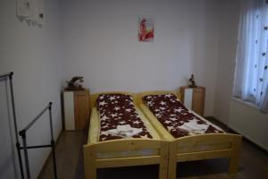 Postel nebo postele na pokoji v ubytování Elekes Apartmans