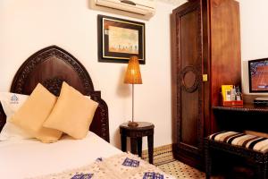 Postel nebo postele na pokoji v ubytování Riad El Amine Fès - Historic Hotels Worldwide