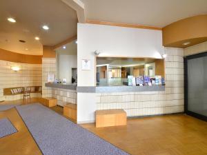 a lobby with a waiting area with a waiting room at Hotel S-PAL in Hakodate