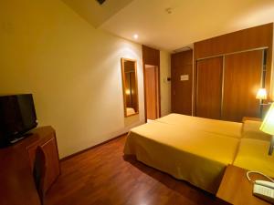 TV a/nebo společenská místnost v ubytování Hotel Berga Park