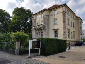 a building with a sign in front of it at Hotel-Villa Lalee in Dresden