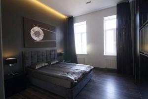 A bed or beds in a room at Apartment Ruska Street