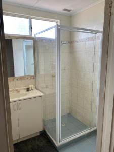 a bathroom with a shower and a sink at Central Views in Jurien Bay