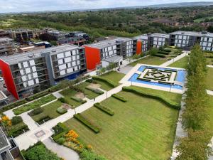 an aerial view of a park with buildings at iStay Apartments Vizion in Milton Keynes
