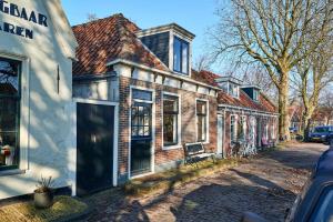 a row of brick houses on a street at Family home in Edam