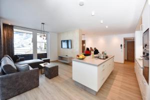 Televízia a/alebo spoločenská miestnosť v ubytovaní C(h)illas Appartements