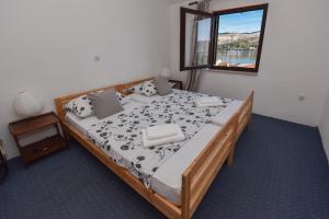 A bed or beds in a room at Planika Pag Sea view