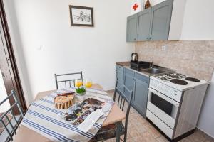 A kitchen or kitchenette at Planika Pag Sea view
