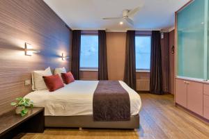 Postel nebo postele na pokoji v ubytování Hotel Astoria Gent