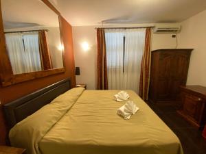 Postel nebo postele na pokoji v ubytování Park Hotel Serenissima