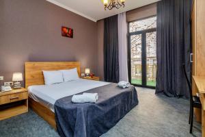 מיטה או מיטות בחדר ב-Hotel Marlyn