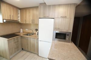A kitchen or kitchenette at DIFFERENTFLATS Samoa