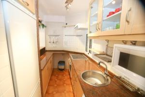 a small kitchen with a sink and a sink at DIFFERENTFLATS Santa Rosa in Salou
