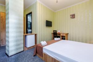 TV a/nebo společenská místnost v ubytování Hotel Marlyn