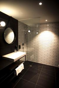 a bathroom with a sink and a mirror at ibis Wels in Wels