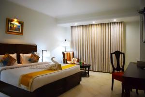 Green View by Green Tree Hotels客房内的一张或多张床位