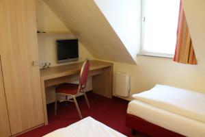 TV a/nebo společenská místnost v ubytování Hotel Scholz