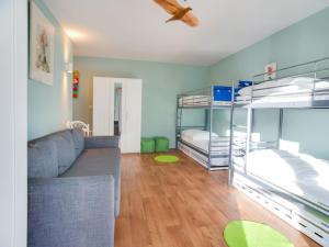 a living room with bunk beds and a couch at Luxury Pool Villa in Sosoye in Sosoye +31 photos