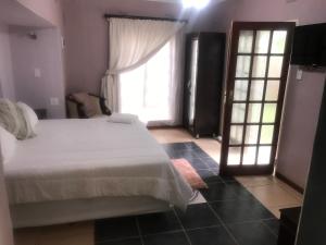 Un ou plusieurs lits dans un hébergement de l'établissement Ankuweni Guest house