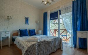 Postel nebo postele na pokoji v ubytování Green Gile Villa in Druskininkai Center