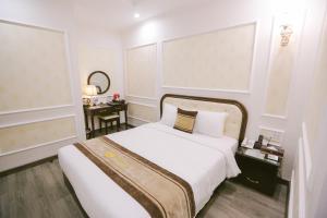 Voodi või voodid majutusasutuse Vincent Halong Hotel toas
