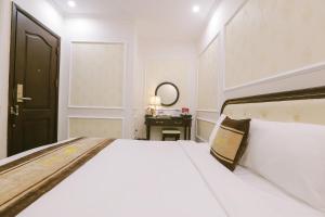 Voodi või voodid majutusasutuse Vincent Halong Hotel toas